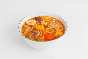 Bun Rieu Cua, Crab paste vermicelli soup with minced shrimp, tofu, tomato, shrimp paste, Vietnamese food isolated on white background, perspective view