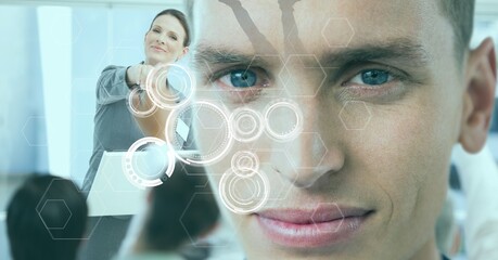 Multiple scope scanning over portrait of caucasian man against caucasian businesswoman at office