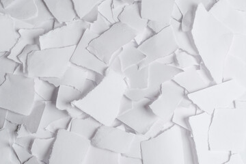 Empty white paper pieces as a background.