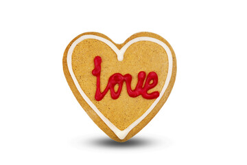 gingerbread in the shape of heart with the inscription love isolated on white background