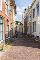 Fototapeta na wymiar A narrow street in the center of the city of Leeuwarden in the Netherlands.