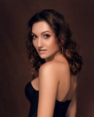 Fototapeta premium Sexy girl in a black corset and gloves