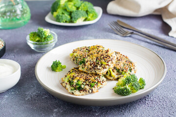 Fried quinoa and broccoli mix pancakes on a plate.