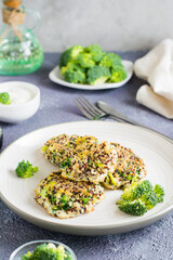 Fried quinoa and broccoli mixture pancakes on a plate. Vertical view