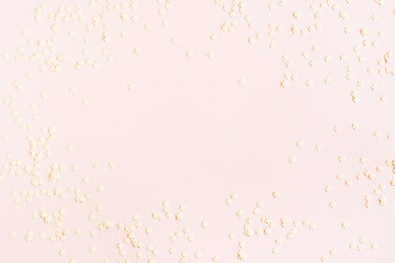 Fototapeta na wymiar Pink abstract background of stars on cardboard