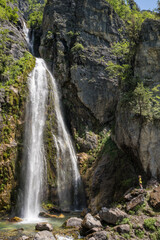 Fototapeta na wymiar Beautiful Theth waterfall near Theth village in Albanian alps mountains