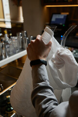 sommelier man wiping dishes decanter for wine.