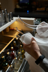 sommelier man wiping dishes decanter for wine.