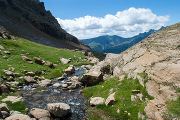 River surrounded by high mountains in a landscape full of mountains and nature