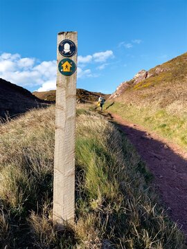 Wales Coast Path signpost in Pembrokeshire, UK near Freshwater West.
