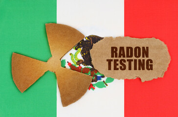On the flag of Mexico, the symbol of radioactivity and torn cardboard with the inscription - Radon...
