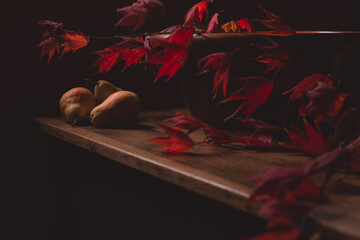Still life of pears with fall maple leaves with copy space