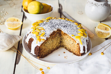 Lemon Poppy Seed Cake made from corn flour decorated with Icing and candied lemon