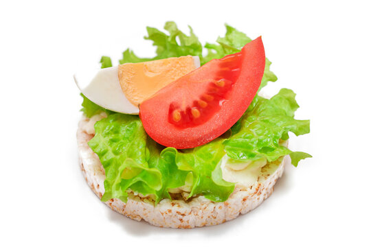 Rice Cake Sandwich with Tomato, Lettuce and Egg - Isolated on White. Easy Breakfast. Diet Food. Quick and Healthy Sandwiches. Crispbread with Tasty Filling. Healthy Dietary Snack - Isolation