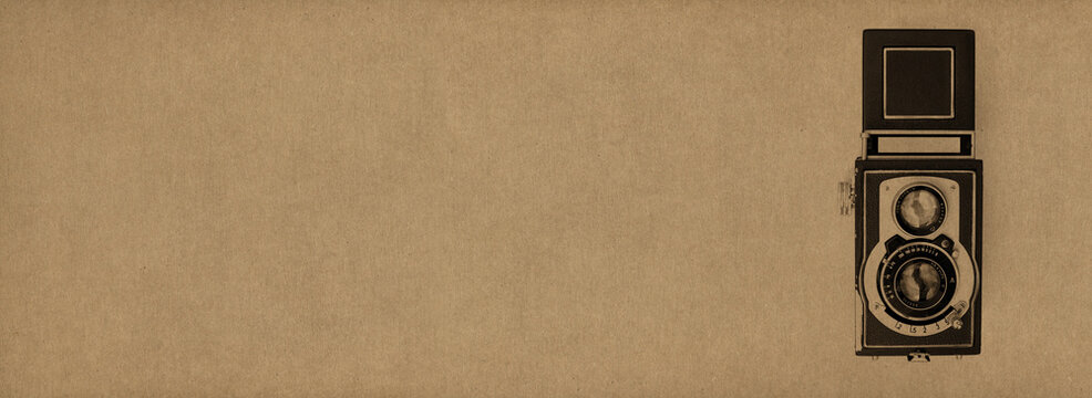 Old Classic Camera Device Front Side Stamp Over A Natural Home Made Light Brown Paper Background