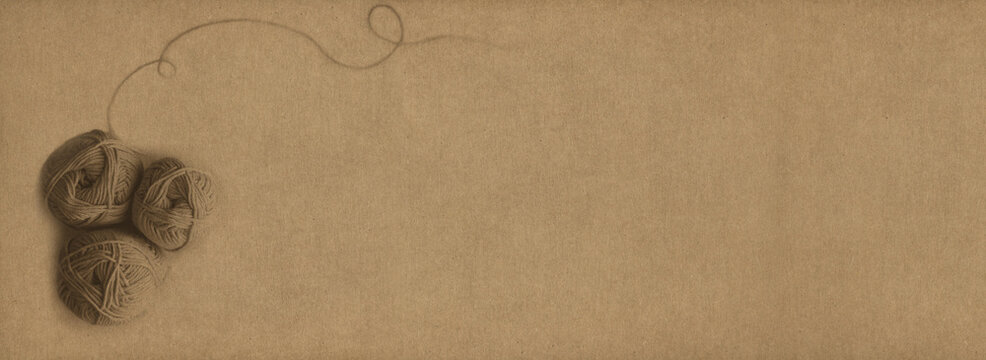 Sepia Colored Wool Skeins Stamp Over A Natural Home Made Light Brown Paper Background