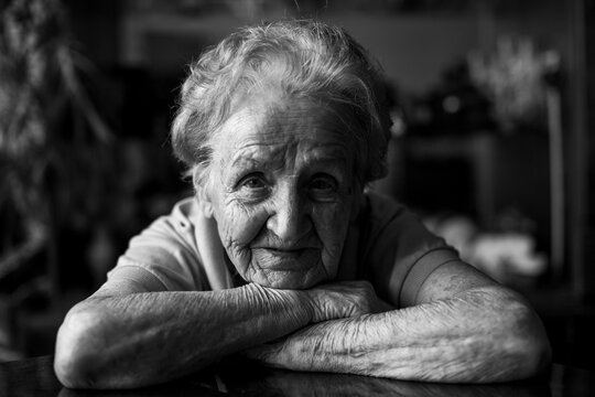 Portrait of an old woman. Black and white photo.