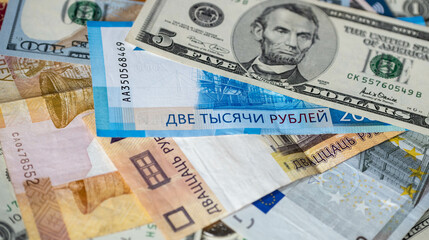 Russia - March 05.2022 dollar bills, Belarusian ruble, euro, Russian ruble