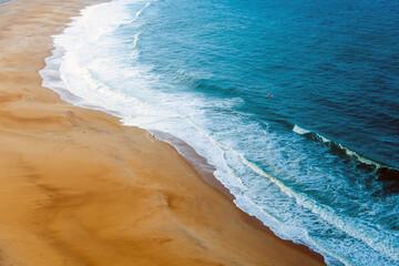 View from above on the beach of the city of Nazare in Portugal.