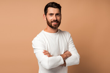 Portrait of bearded handsome man in casual style looking at the camera and smiling