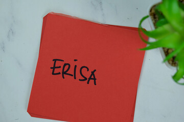 ERISA write on sticky notes isolated on Wooden Table.