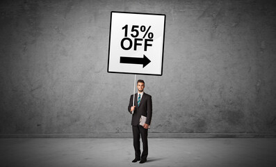 Obraz premium business person holding a traffic sign concept