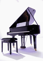 black grand piano on white background © serhii
