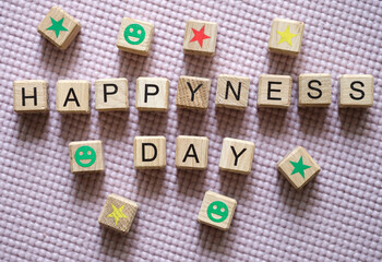 Text happy day and asterisks and smiles on cubes