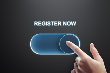 Close up of male finger turning on slider button on black background. Registration and success...