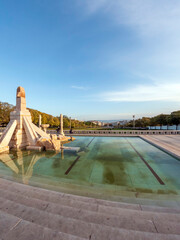 The central lane of Eduardo VII Park, with Lisbon and the Tagus river in the background, a public...