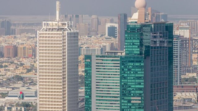 Aerial view of skyscrapers with World Trade center in Dubai timelapse.