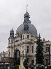 Fototapeta premium Old railway station building. Building with round rood and peacks. Lviv railway station