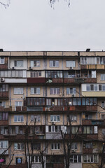 Fototapeta na wymiar Soviet live building with a lot of balconies in the city. Old soviet building. Panel living house with balconies. Full view, background. Closeup of typical soviet residental building.