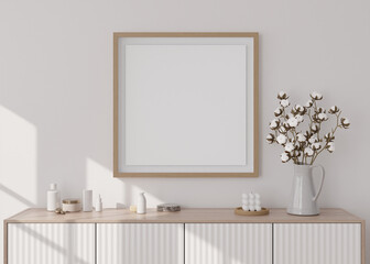 Fototapeta na wymiar Empty square picture frame on white wall in modern living room. Mock up interior in minimalist, scandinavian style. Free, copy space for picture. Console, cotton plant, vase. 3D rendering.