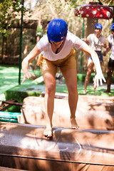 Two teams compete on an obstacle course in an amusement park. High quality photo