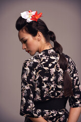 Fototapeta premium Traditional dress. Studio shot of an attractive young woman dressed in traditional asian clothing.
