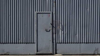 large gray metal door from industrial building