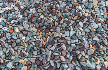 Nature pebbles background. Blue pebbles texture. Stone background