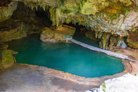 Amazing blue turquoise water and limestone cave sinkhole cenote Mexico.