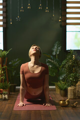 modern female stretching in modern green house
