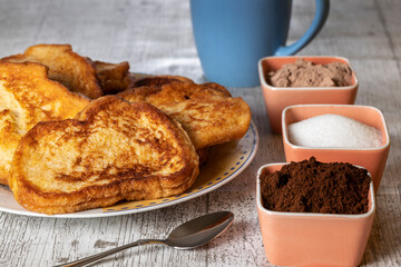 (Torrijas) Fried bread soaked in milk flavored with vanilla, cinnamon and lemon, and egg. Typical Easter sweet. Traditional and festive cuisine concept