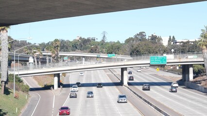 Multiple lane highway interchange or intersection, freeway overpass bridge. Cars traffic on road,...