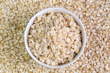 Healthy breakfast oatmeal porridge in bowl. Hot mashed oats, vegan vegetarian weight loss diet breakfast food