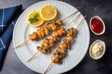Fried mussels, delicious skewered mussels (Turkish name; midye tava, cöp sis midye)