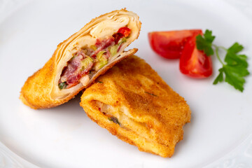 Turkish Pacanga Boregi with pastirma (pastrami) and cheddar (melted) cheese. Pastirmali Borek