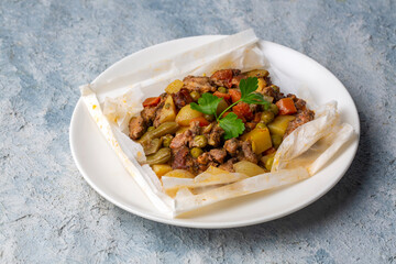 Traditional Turkish food; Meat with vegetables wrapped in greaseproof paper, kebab (Turkish name; Sebzeli kagit kebabi)