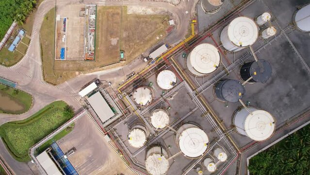 Aerial view white fuel storage tank in oil refinery plant. Top view white Industrial tanks for petrol and oil.High angle view industry business station. Building infrastructure