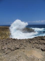 Ocean Waves Striking Volcanic Beach