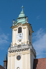 The clock tower of the old town hall bathed in brilliant sunshine.