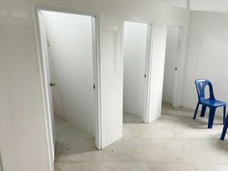 Toilet room for men with urinals sinks and mirrors